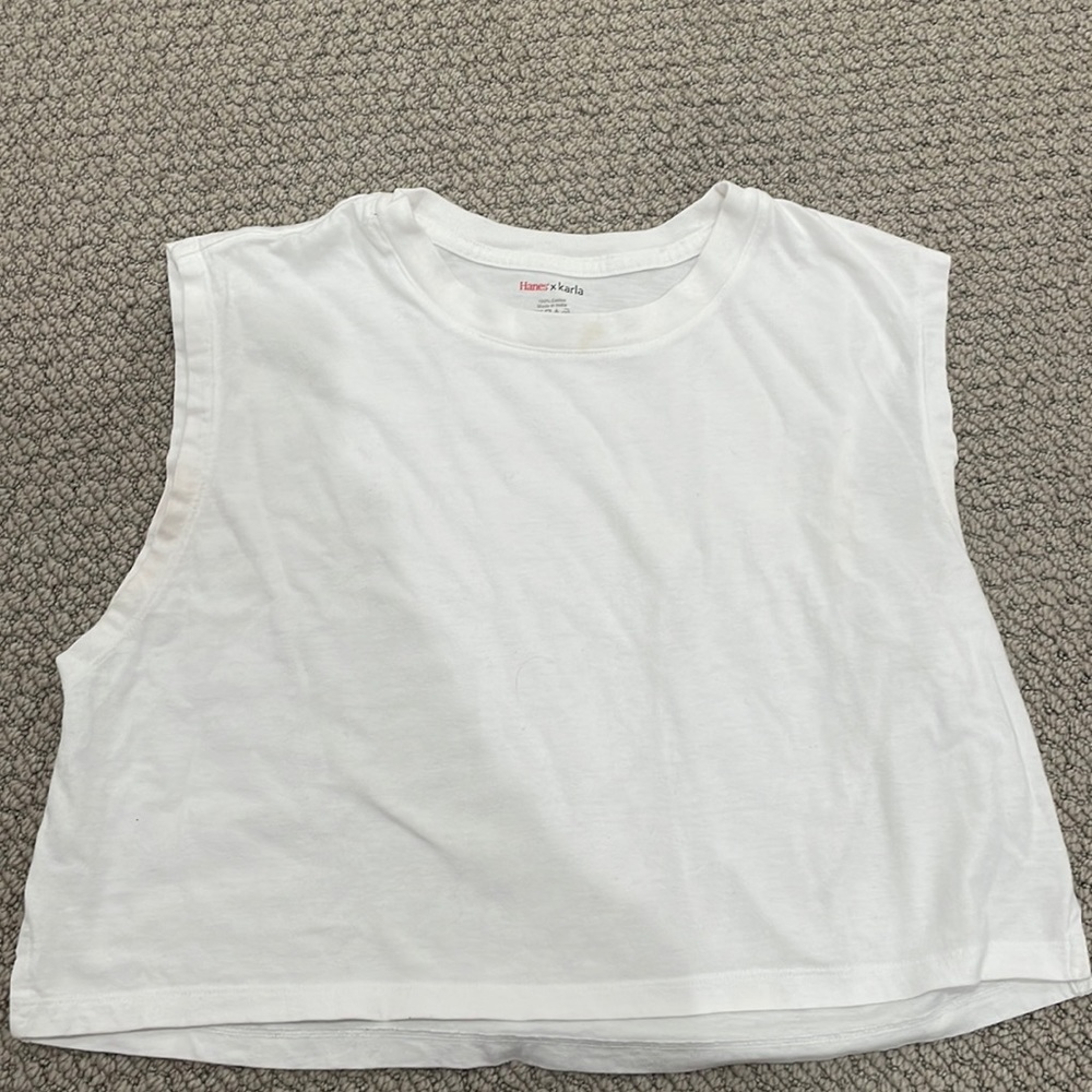 A white cropped sleeves shirt